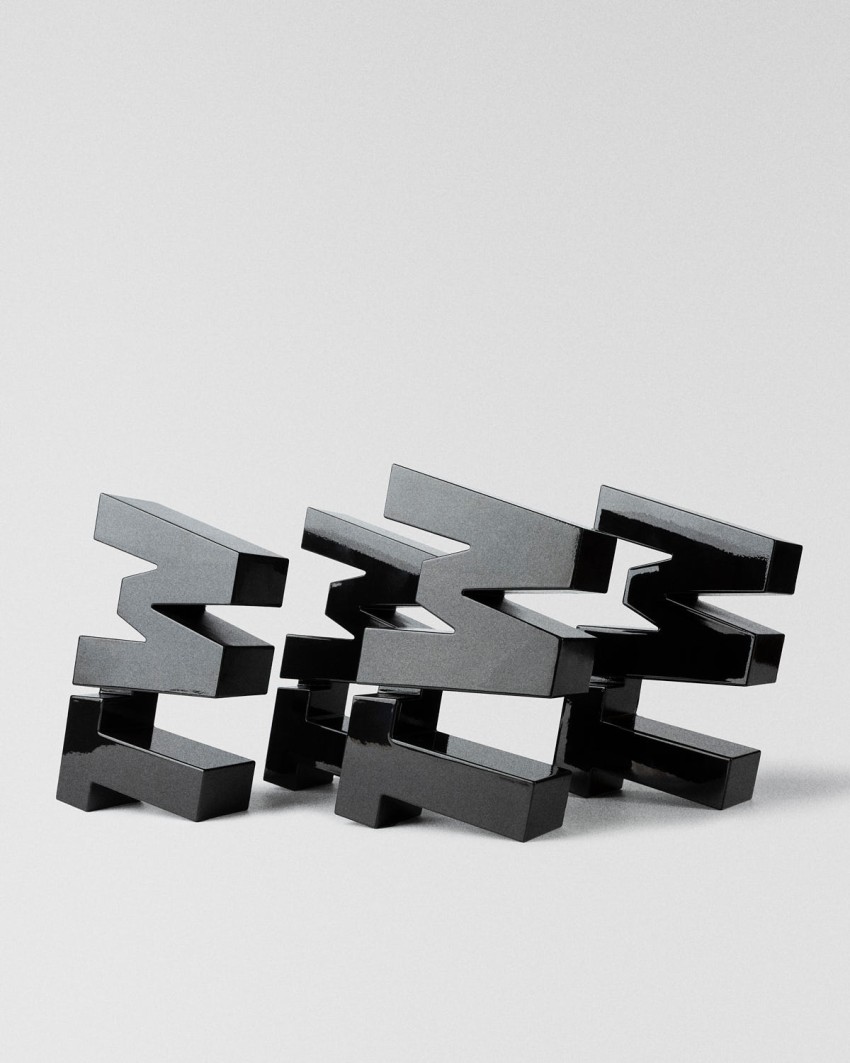 Troféu TextilWirtschaft Forum 2026 TW tipográfico preto